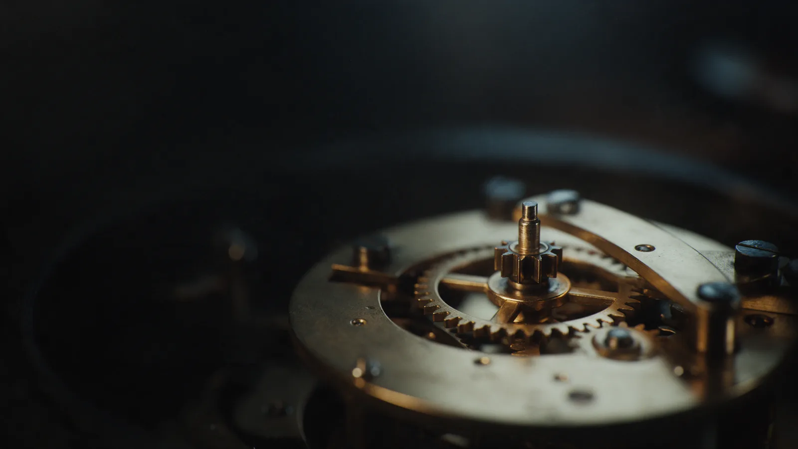 A brass mechanism in warm light.